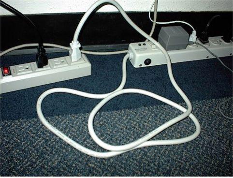 
We see a power strip plugged into another power strip, each with multiple 
loads plugged into it.